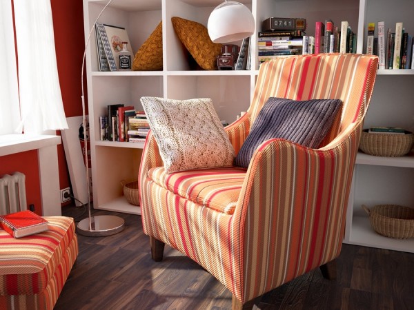 A cozy striped chair in a room with bookshelves.