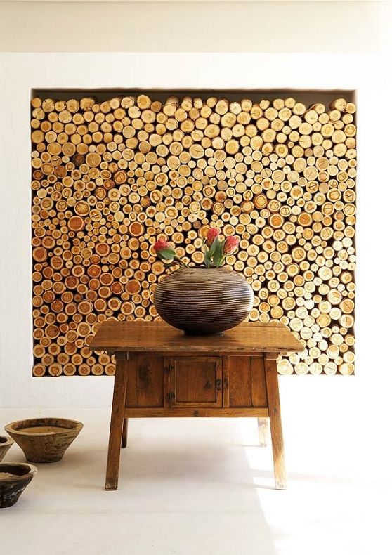 A living room with a tree trunk wall.