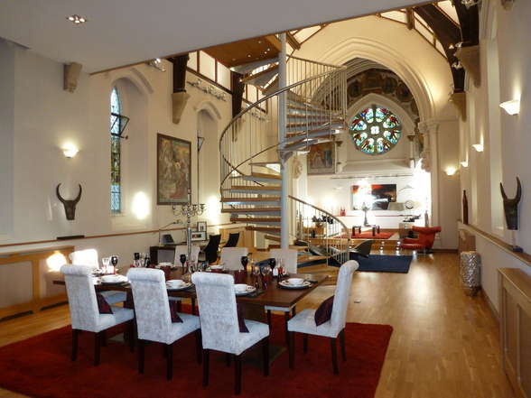 A church dining room with an unconventional spiral staircase.