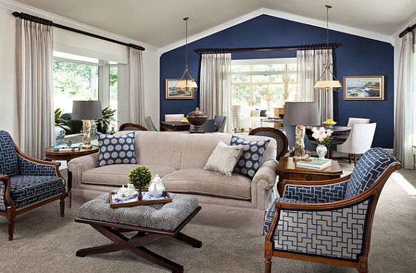 Dark blue accent wall and blue and white accessories distinguish this room