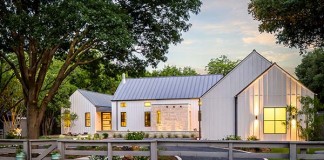 A modern farmhouse looks warm and inviting