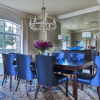 Lovely blue chairs adorn a dining room table