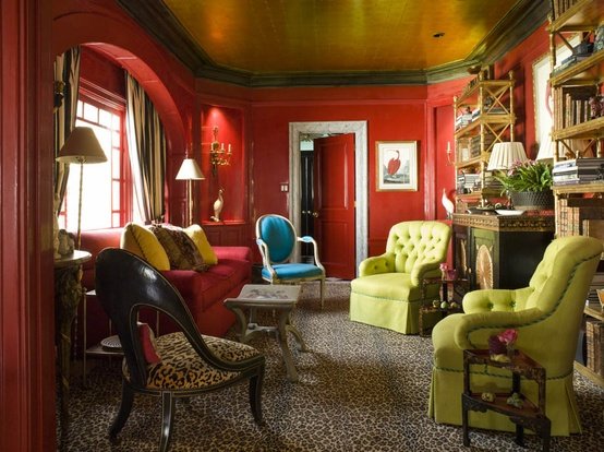 Deep red with green and blue accents set this room apart 