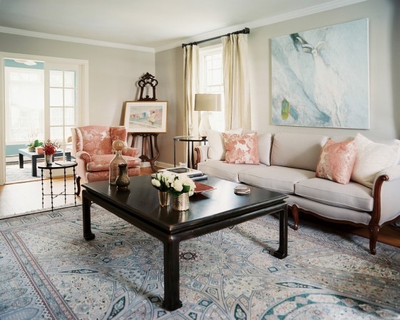A cozy living room with a rug and couches, embodying things that make a house a home.