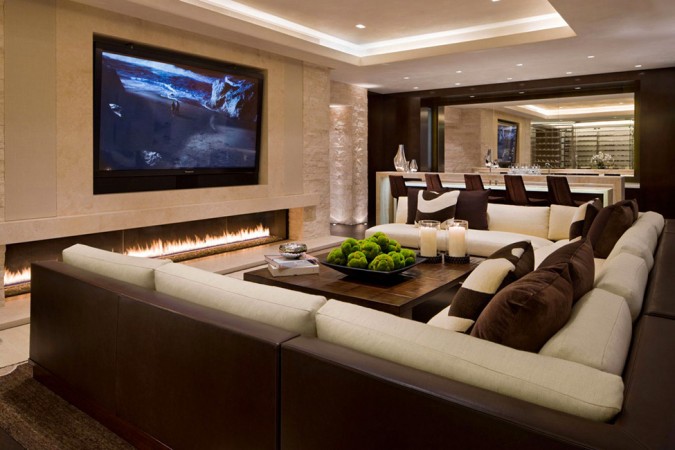 A living room with a fireplace and TV, essential for your home bucket list.