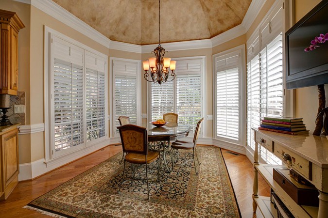 Shutters don't interfere with the beautiful architecture and paint treatments in this room 