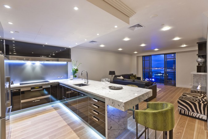 A modern kitchen with a city view.