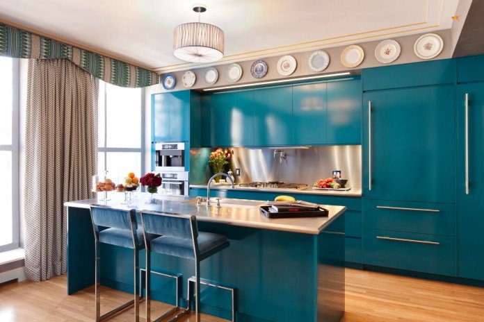 Turquoise cabinets bring vibrant color to this contemporary kitchen