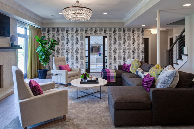 A living room with gray furniture and purple accents that make a house feel like a home.