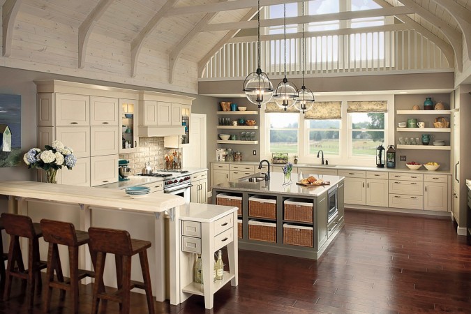 A large kitchen with a vaulted ceiling, blending modern farmhouse style and a little bit of country.