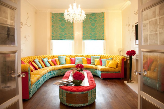 A bold living room with a wonderful couch and a coffee table.