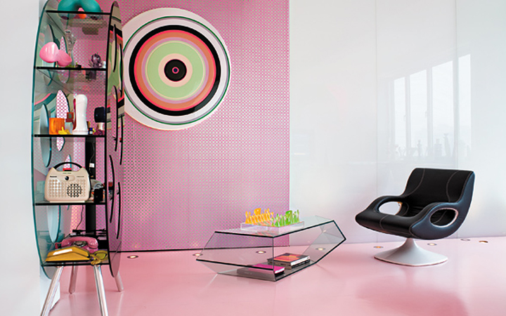 A modern woman chair in a pink room.
