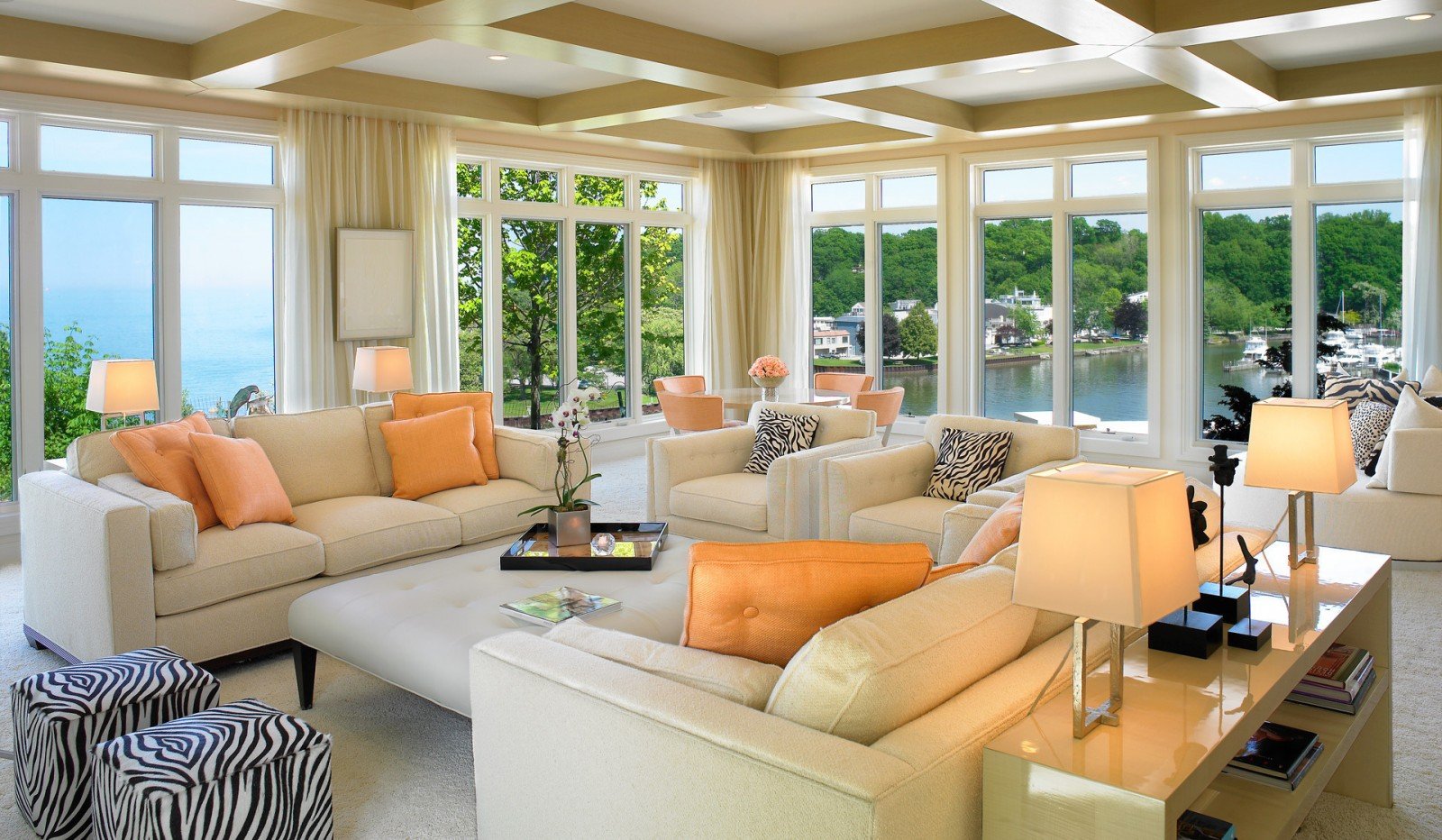 A light-filled living room with a beautiful view of the lake.