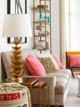 Bold gold accents and splashes of pink create a modern room 