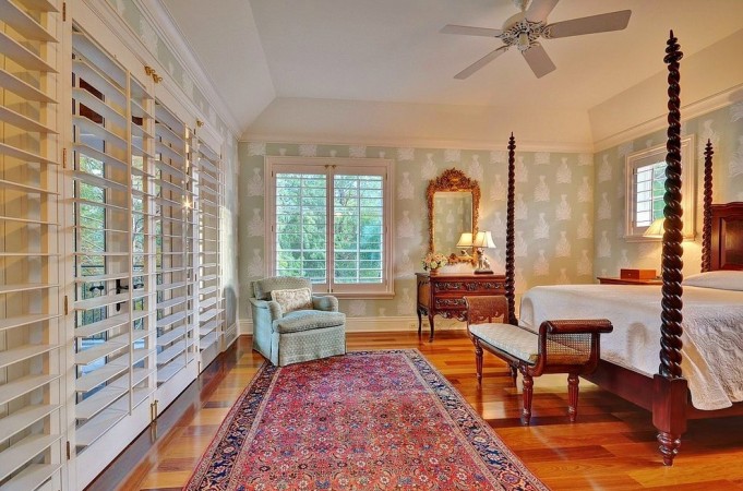 Shutters add instant charm to this lovely bedroom 