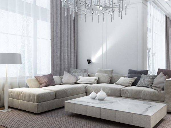 A modern living room with white marble furniture and a chandelier.