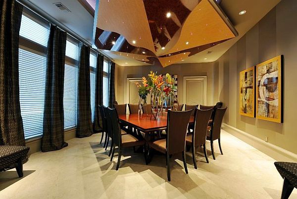 A dining room with a bold and wonderful large table and chairs.
