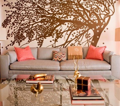 A statement wall decal in gold warms this room