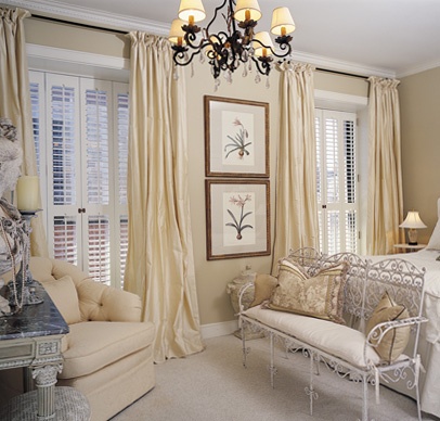 Ivory curtain panels accent window shutters