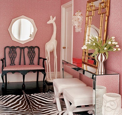 Sweet pink is given a boost with a zebra print rug