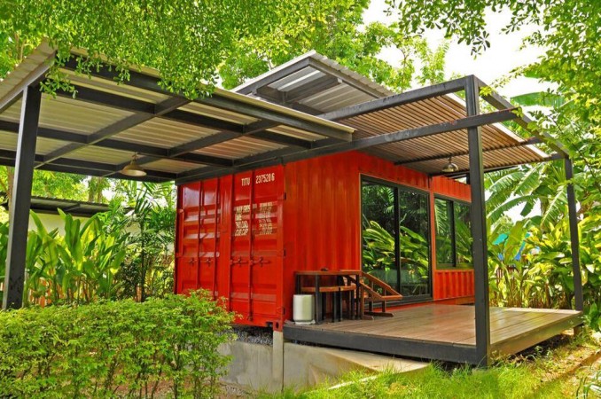 A red container house in the middle of the jungle, a conversation-worthy unconventional home.