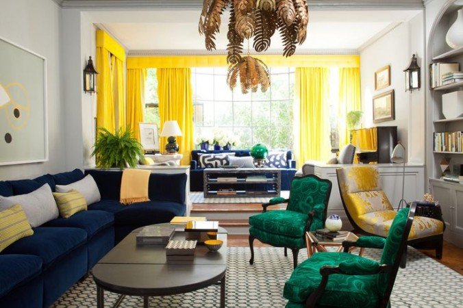 Emerald green and blue sapphire furniture, enveloped in bright yellow window treatments