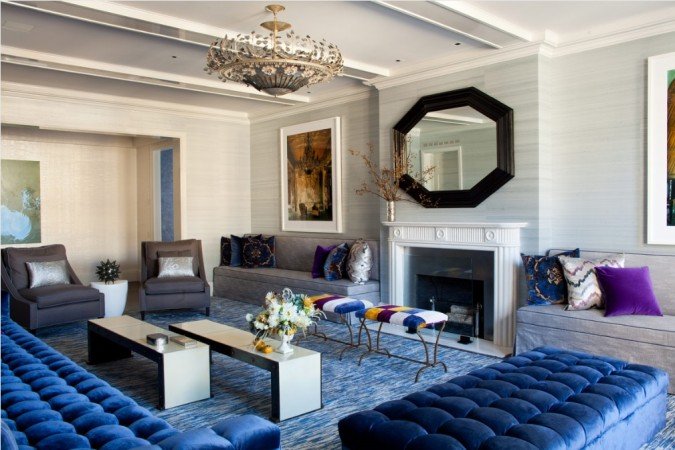 Lovely sapphire blue upholstered pieces highlight this room