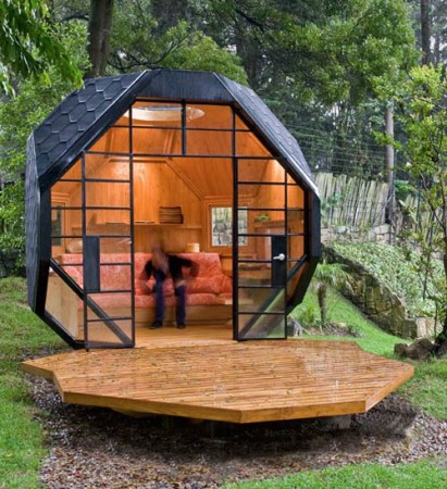 A person is enjoying a Wonderful backyard retreat on a wooden deck.