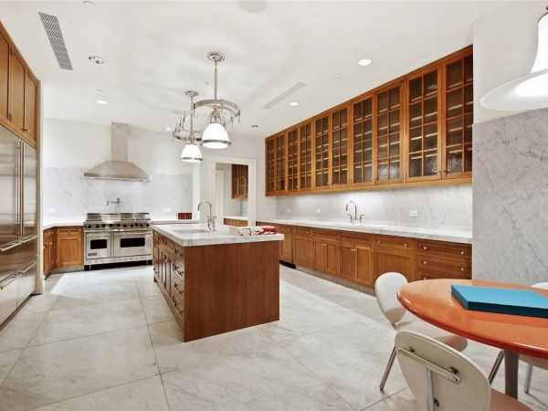 White marble flooring brightens this kitchen