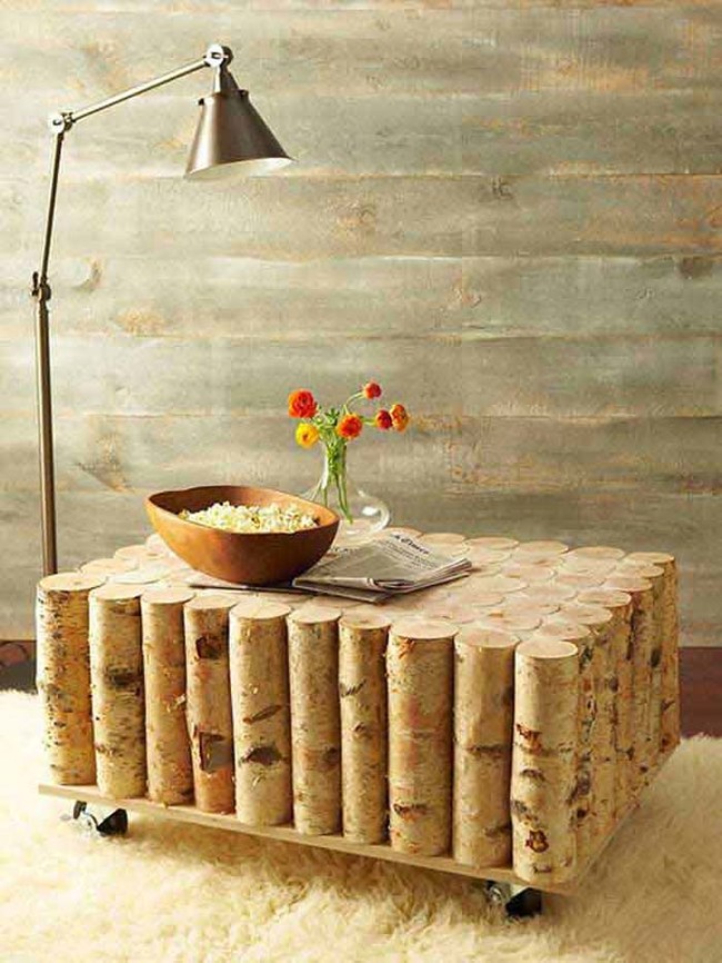 Birch log coffee table on wheels made from a tree trunk.