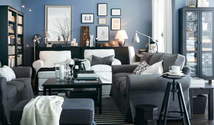 A vibrant living room with blue walls and white furniture that pays homage to a love for interior design in blue.