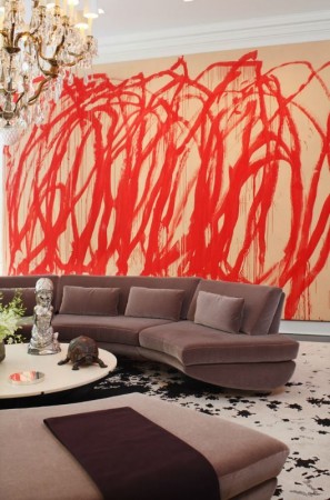 Bold interiors with a large red painting on the wall.
