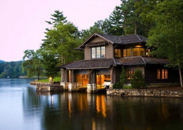 A lakeside retreat surrounded by lush woodland.