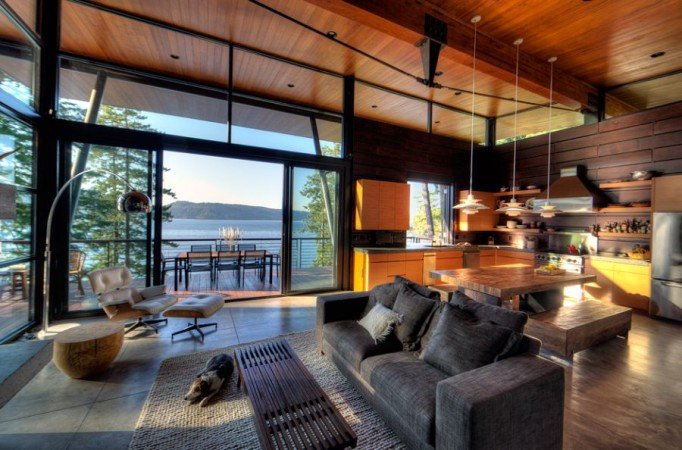 A spacious living room with a lake view.