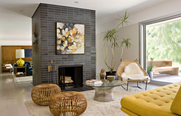 A modern living room with yellow furniture.