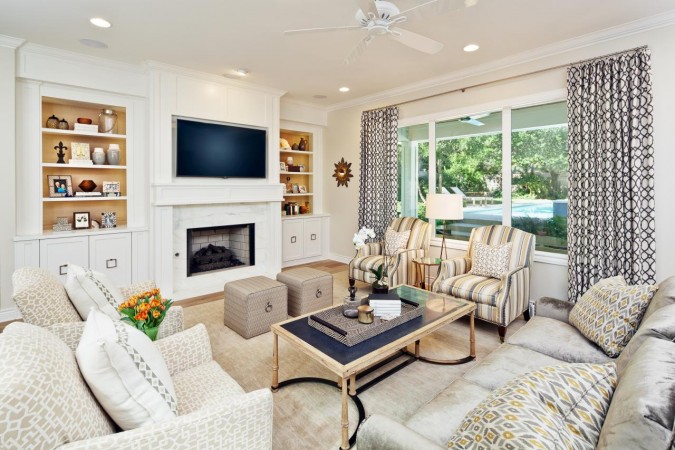 A fresh living room with white furniture.