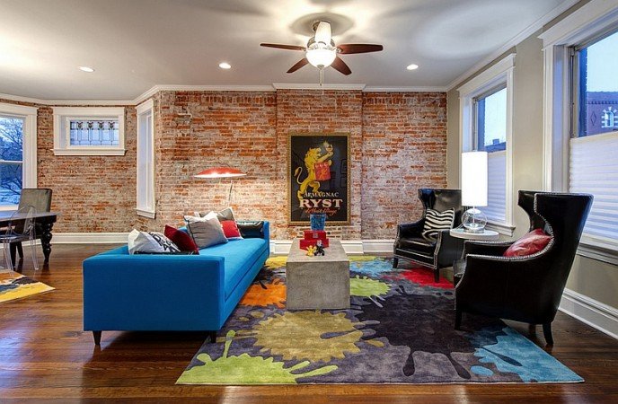 An exposed brick wall adds even more interest to this wonderful space