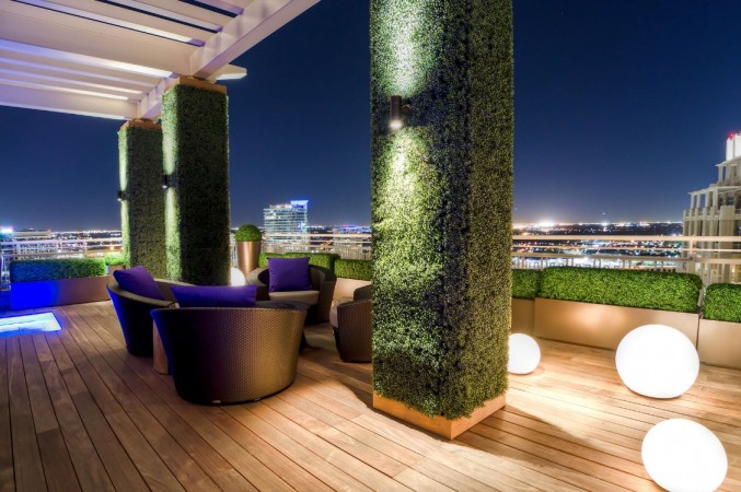 A stylish wooden deck for modern living with a view of the city.