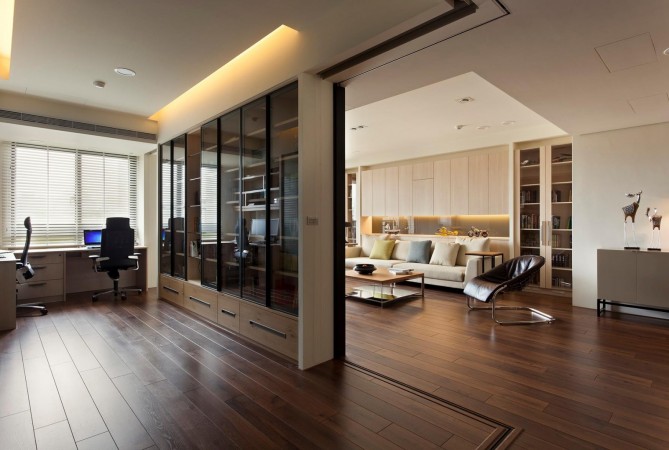 An inspiring living room with hardwood floors and a sliding glass door.