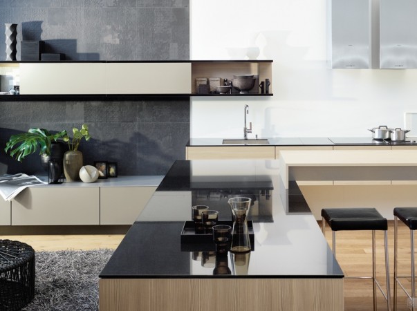 A modern kitchen island with stools.