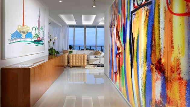 A colorful painting in a modern hallway.