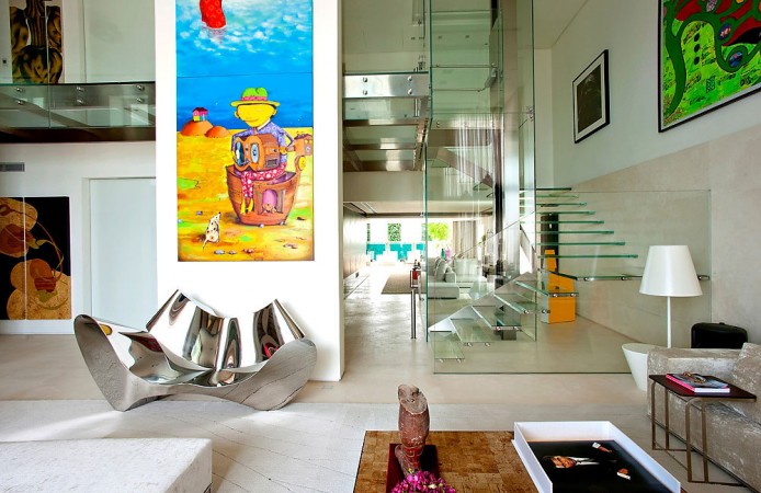 A living room with a large painting on the wall, designed for modern interiors.