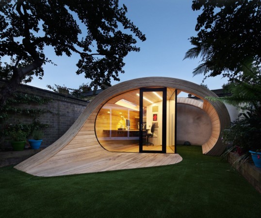 A wooden office with a curved roof that breaks the mold.