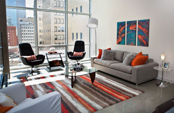 A colorful area rug and artwork boost this modern interior
