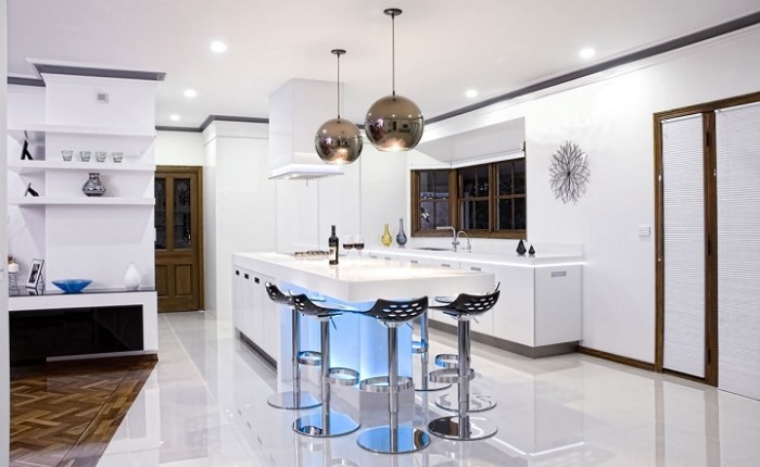 A modern kitchen with a white island.