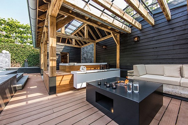 A tabletop fire and hot tub add to the comfort in this modern outdoor living area