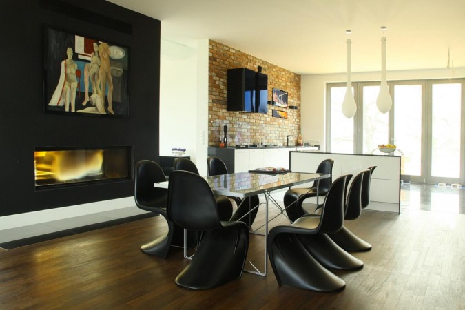 Modern sculptural chairs adorn this dining area