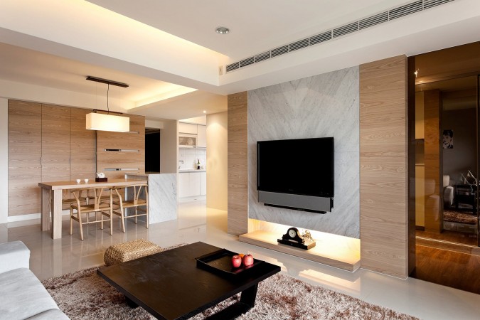 A modern living room with a tv and a coffee table designed for every taste.