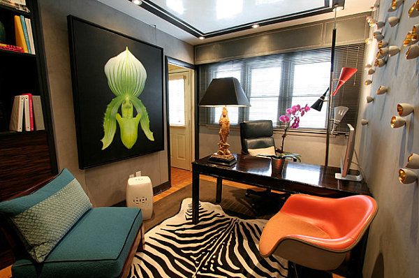 A home office with a zebra print rug and chair that breaks the mold of traditional designs.