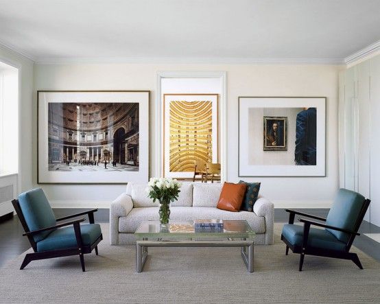 A modern living room filled with beautiful paintings.